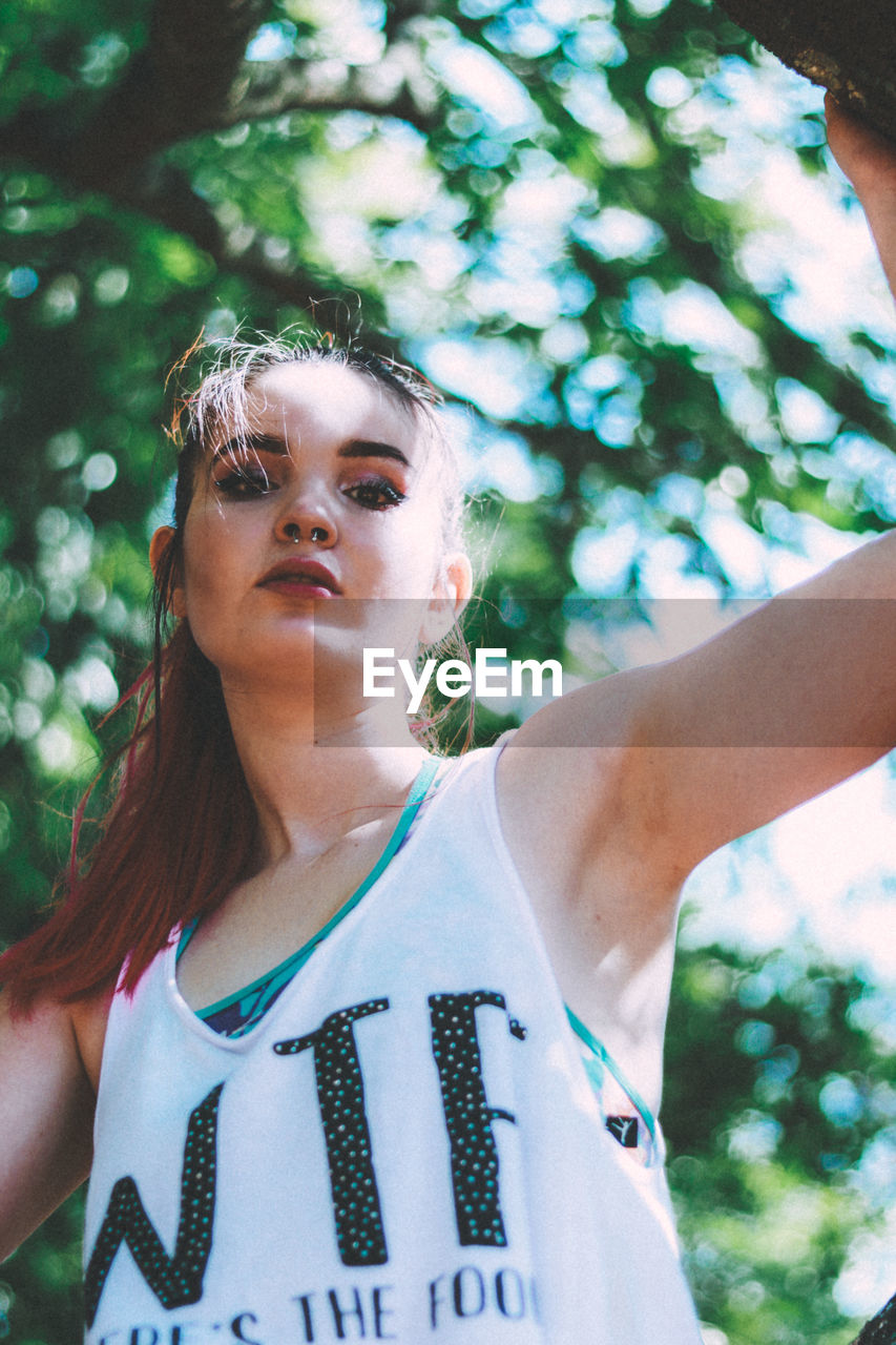 Low angle view of young woman in park