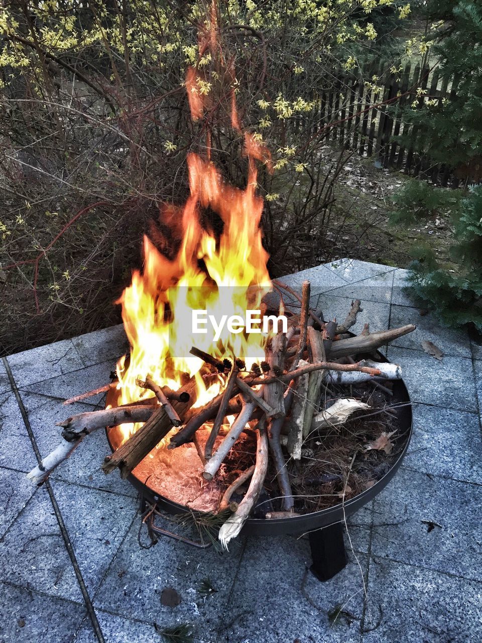 High angle view of burning fire pit in yard