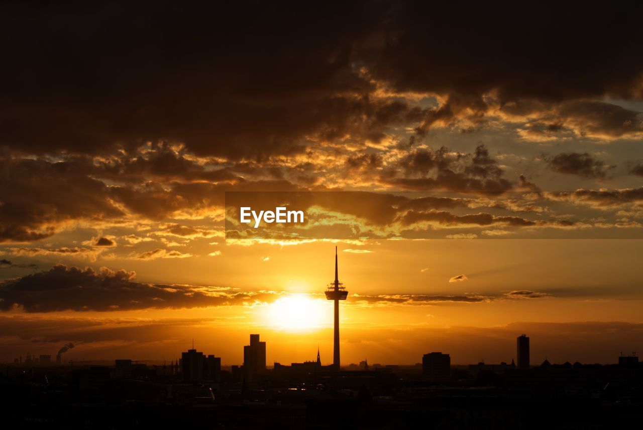 SILHOUETTE OF BUILDINGS AT SUNSET