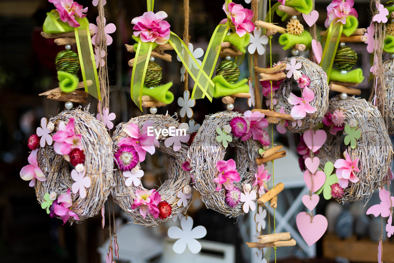 CLOSE-UP OF PINK FLOWERING PLANTS IN SHOP