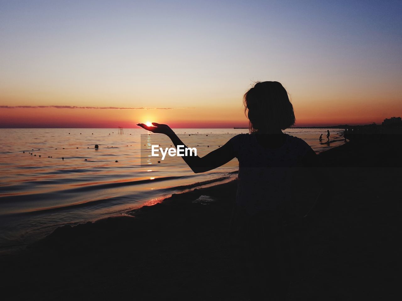 SILHOUETTE BOY ON BEACH AGAINST SKY DURING SUNSET