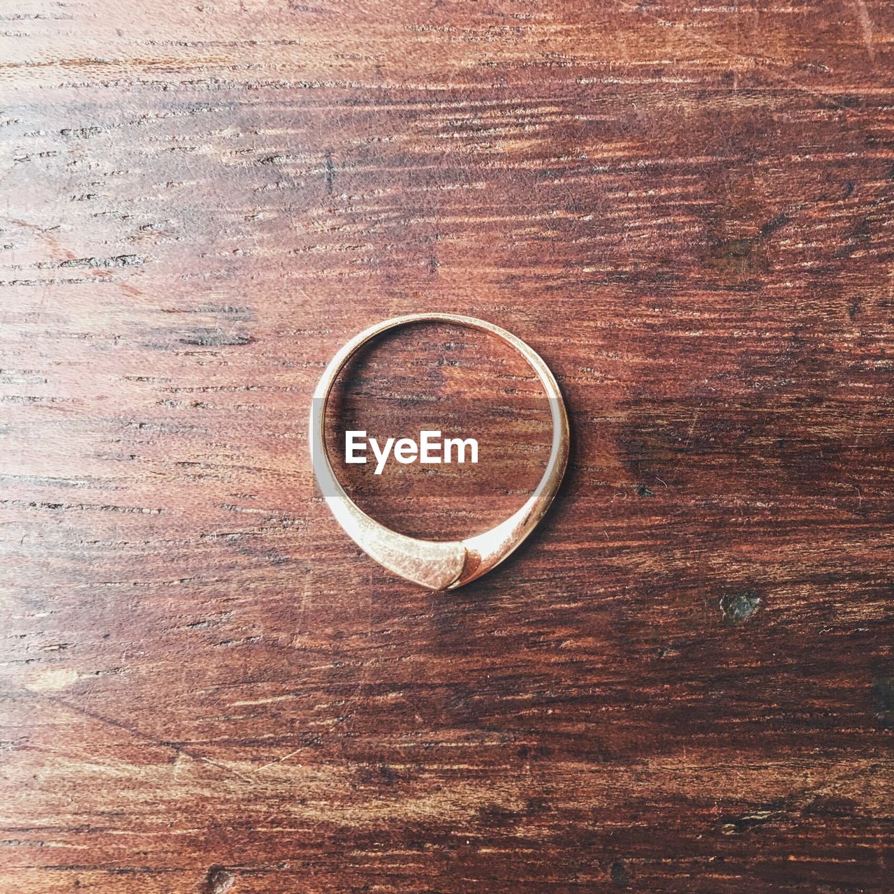 Close-up of ring on wooden table