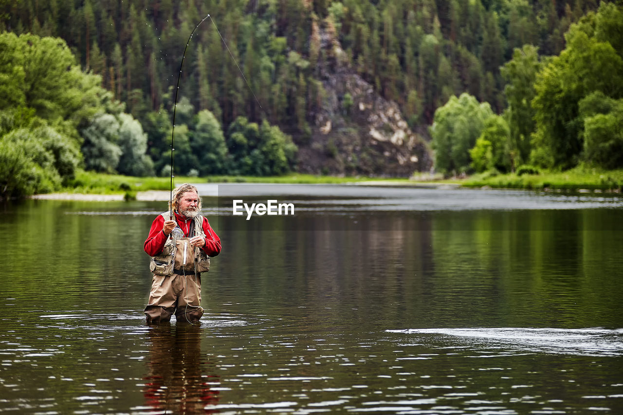 PORTRAIT OF GIRL IN LAKE