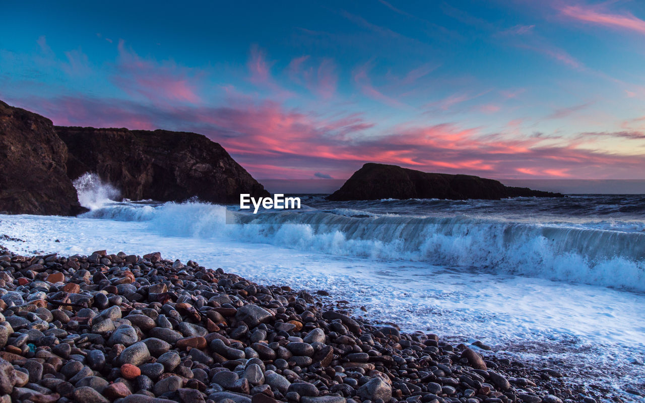 Scenic view of sea against sky during sunset