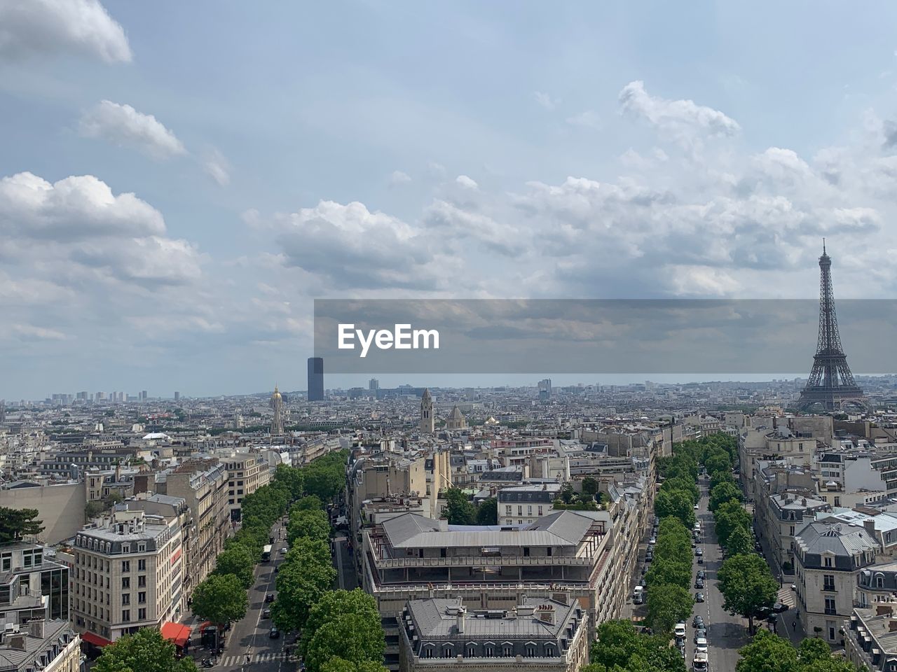 HIGH ANGLE VIEW OF CITY BUILDINGS AGAINST CLOUDY SKY