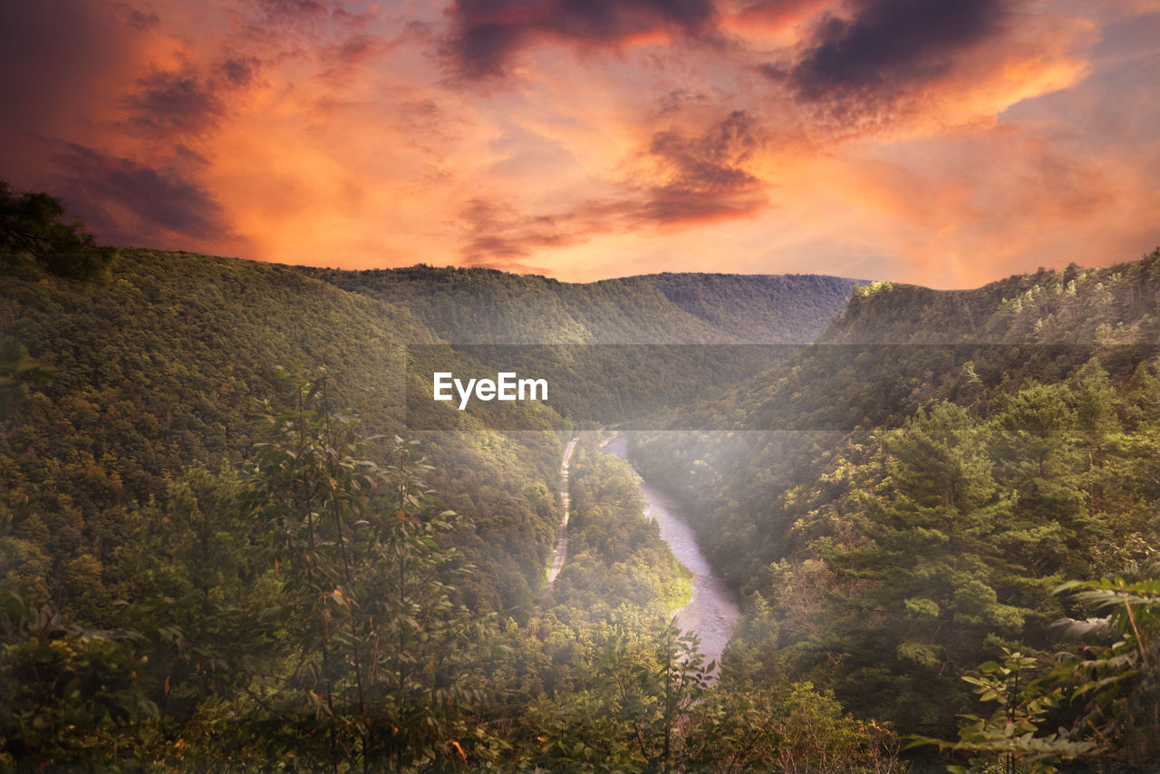 SCENIC VIEW OF MOUNTAINS DURING SUNSET