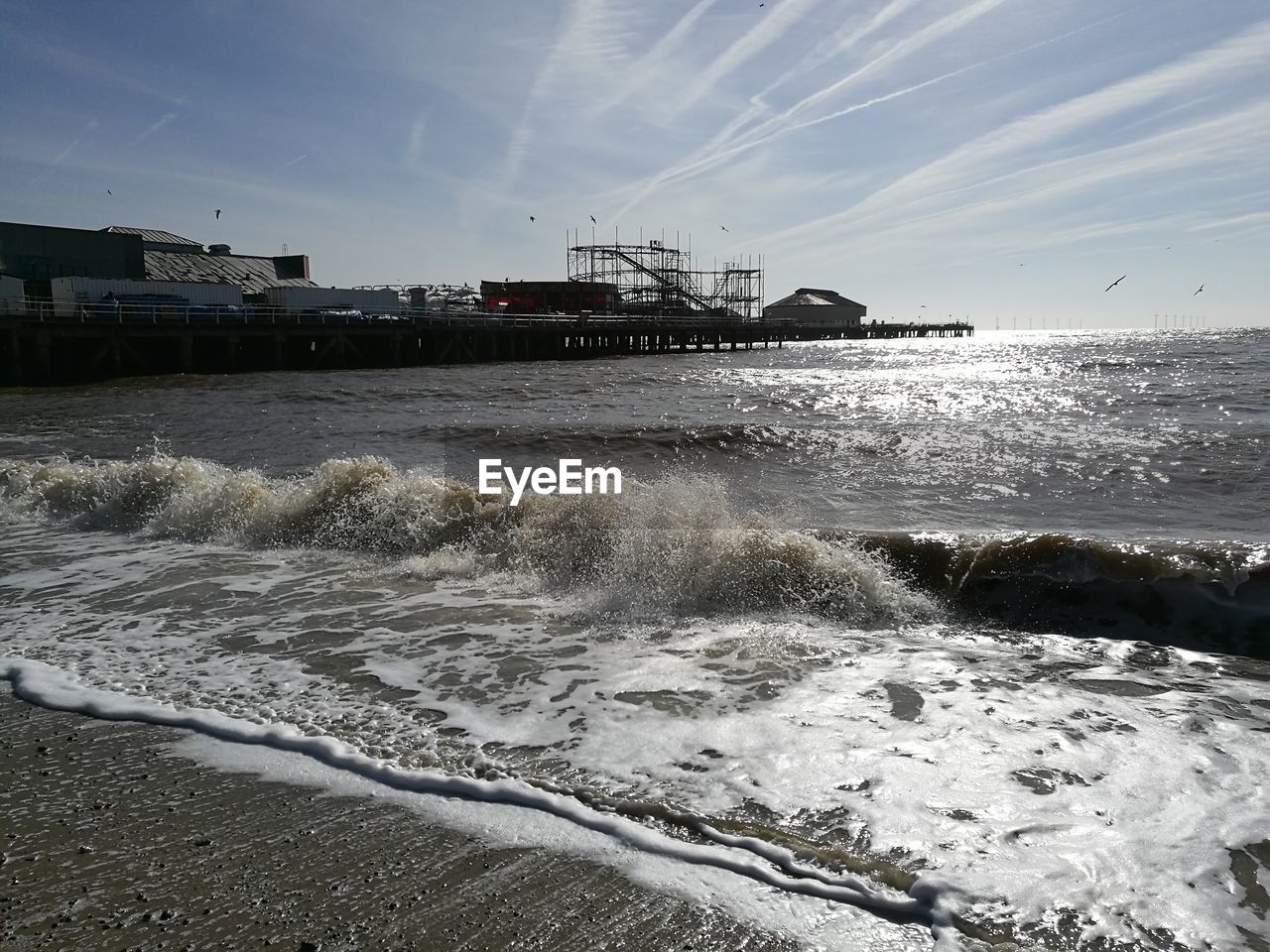 SCENIC VIEW OF SHORE AGAINST SKY