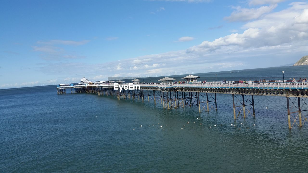 SCENIC VIEW OF PIER OVER SEA AGAINST SKY