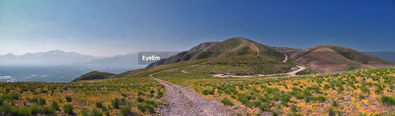 scenic view of mountains against clear blue sky