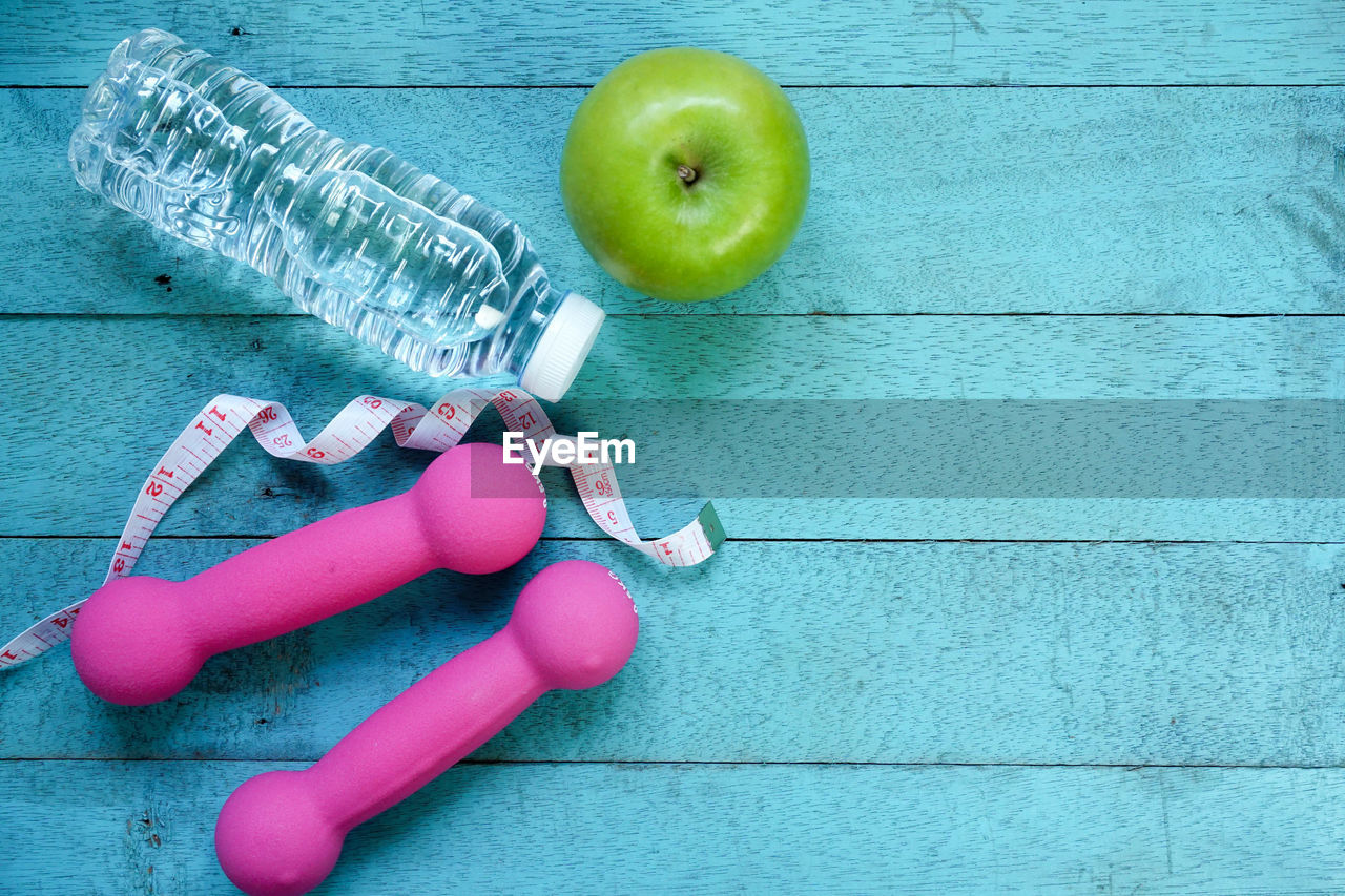 Close-up of exercise equipment on blue table