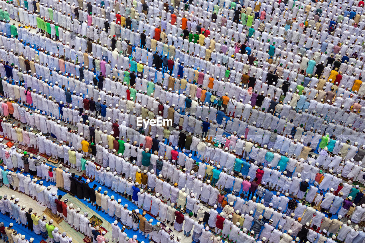 High angle view of islamic men praying outdoors