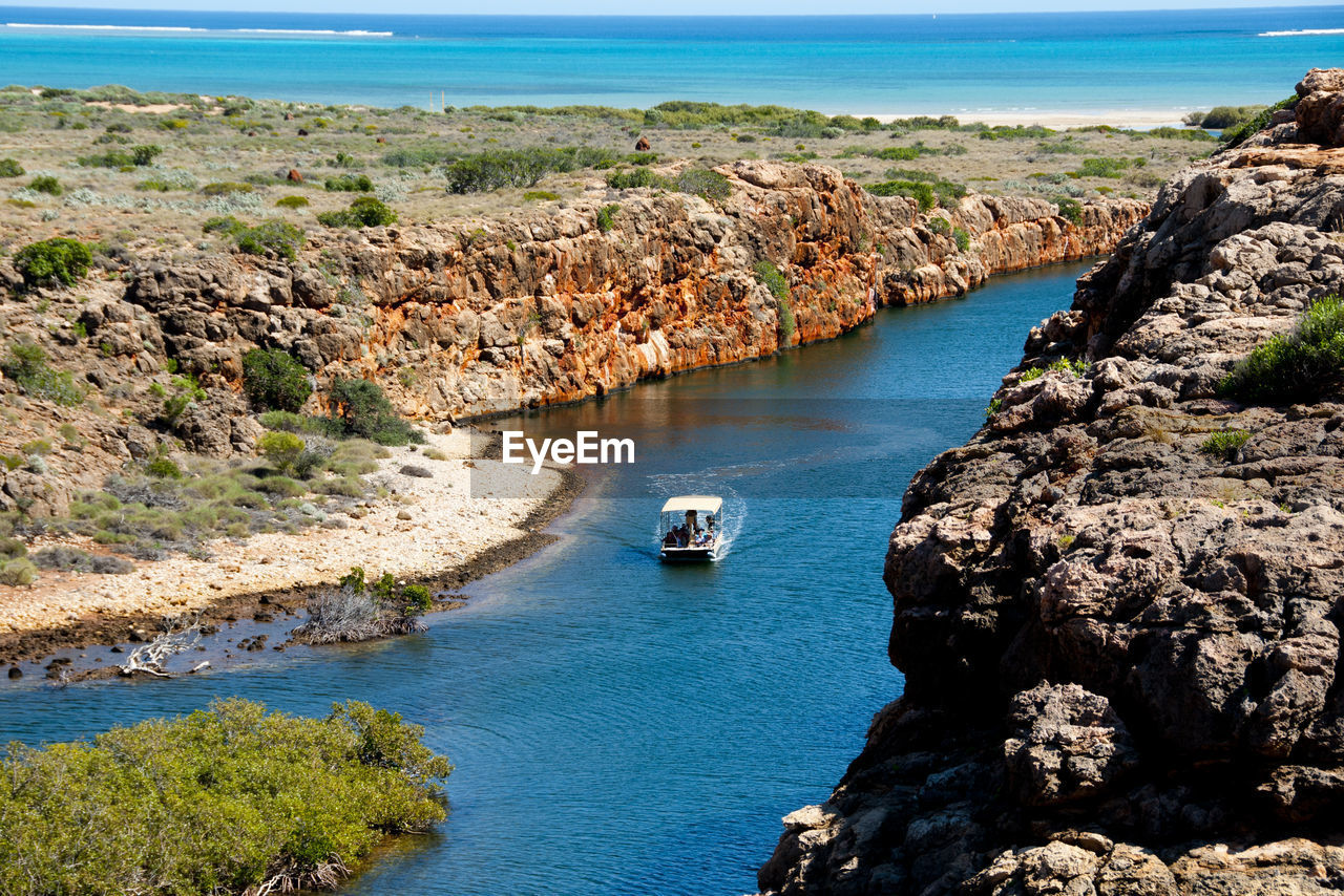 High angle view of rocks at sea shore