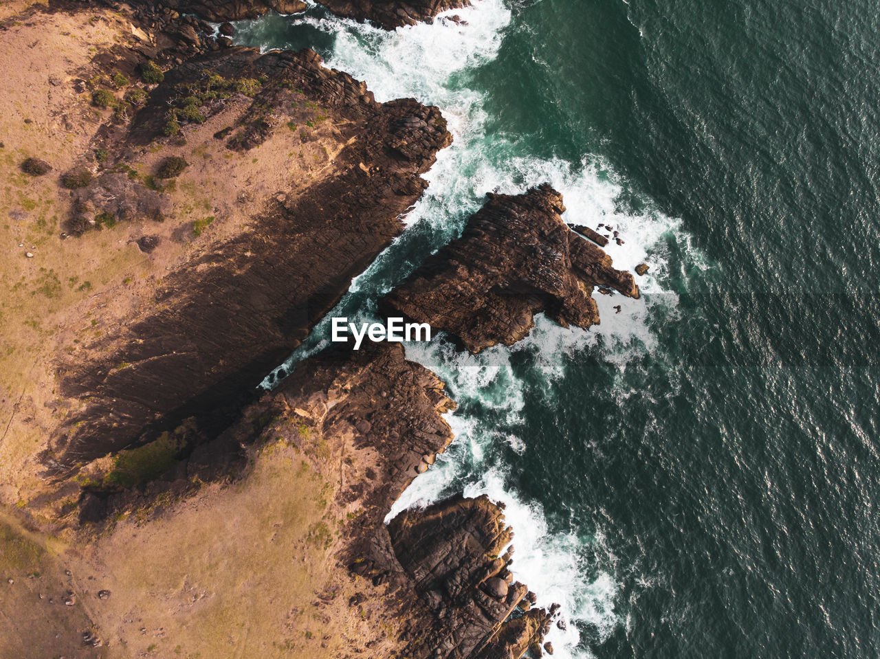 High angle view of rocks in sea