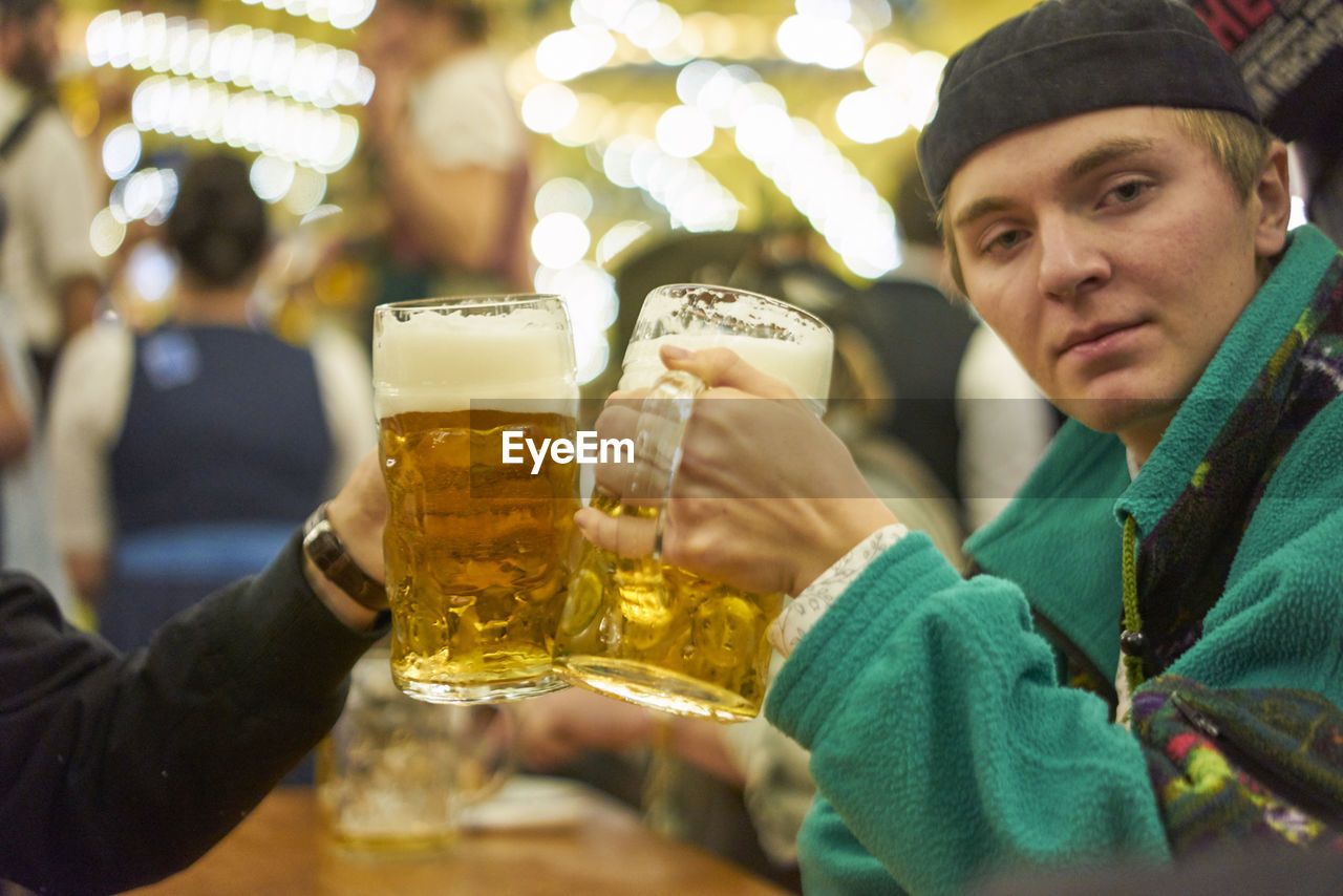 Portrait of man drinking beer