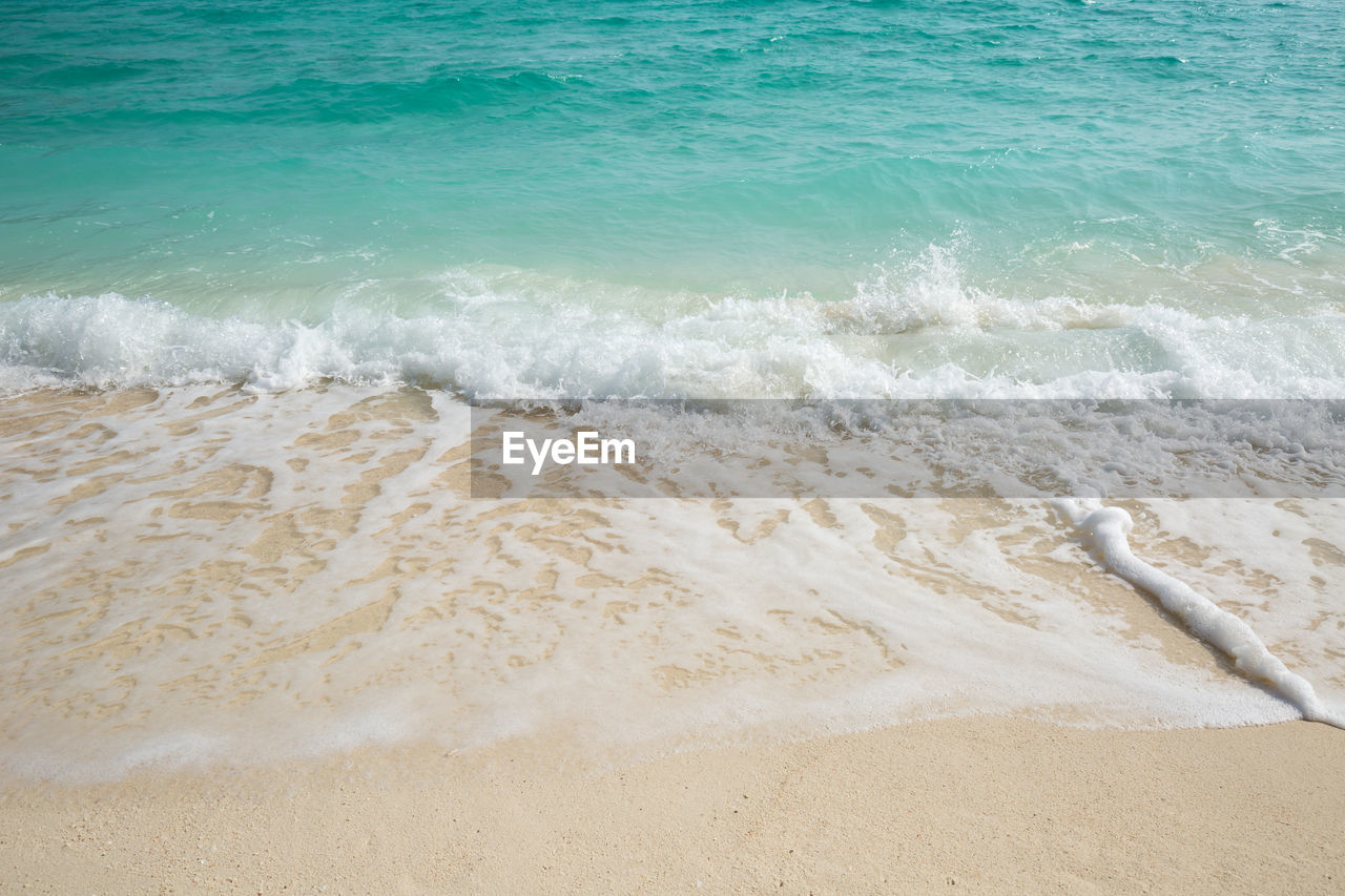 WAVES BREAKING ON SHORE