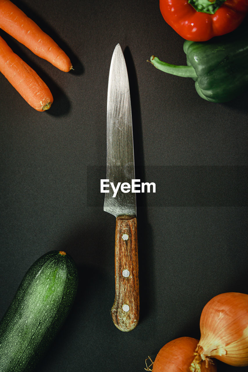 HIGH ANGLE VIEW OF CHOPPED VEGETABLES ON TABLE AGAINST BLACK BACKGROUND