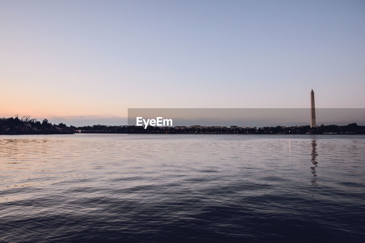 VIEW OF CALM SEA AT SUNSET