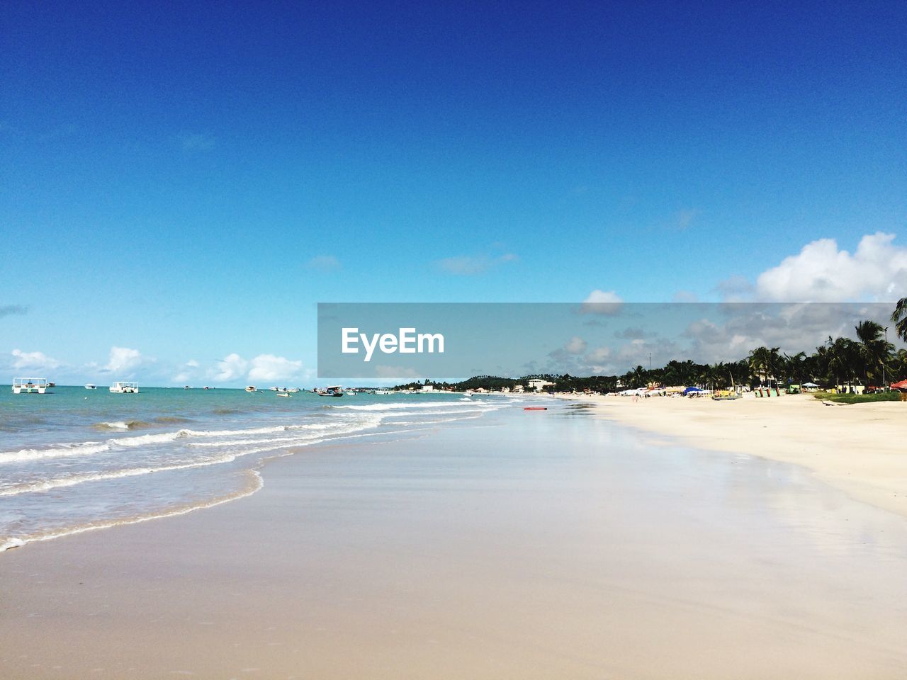 View of beach against cloudy sky