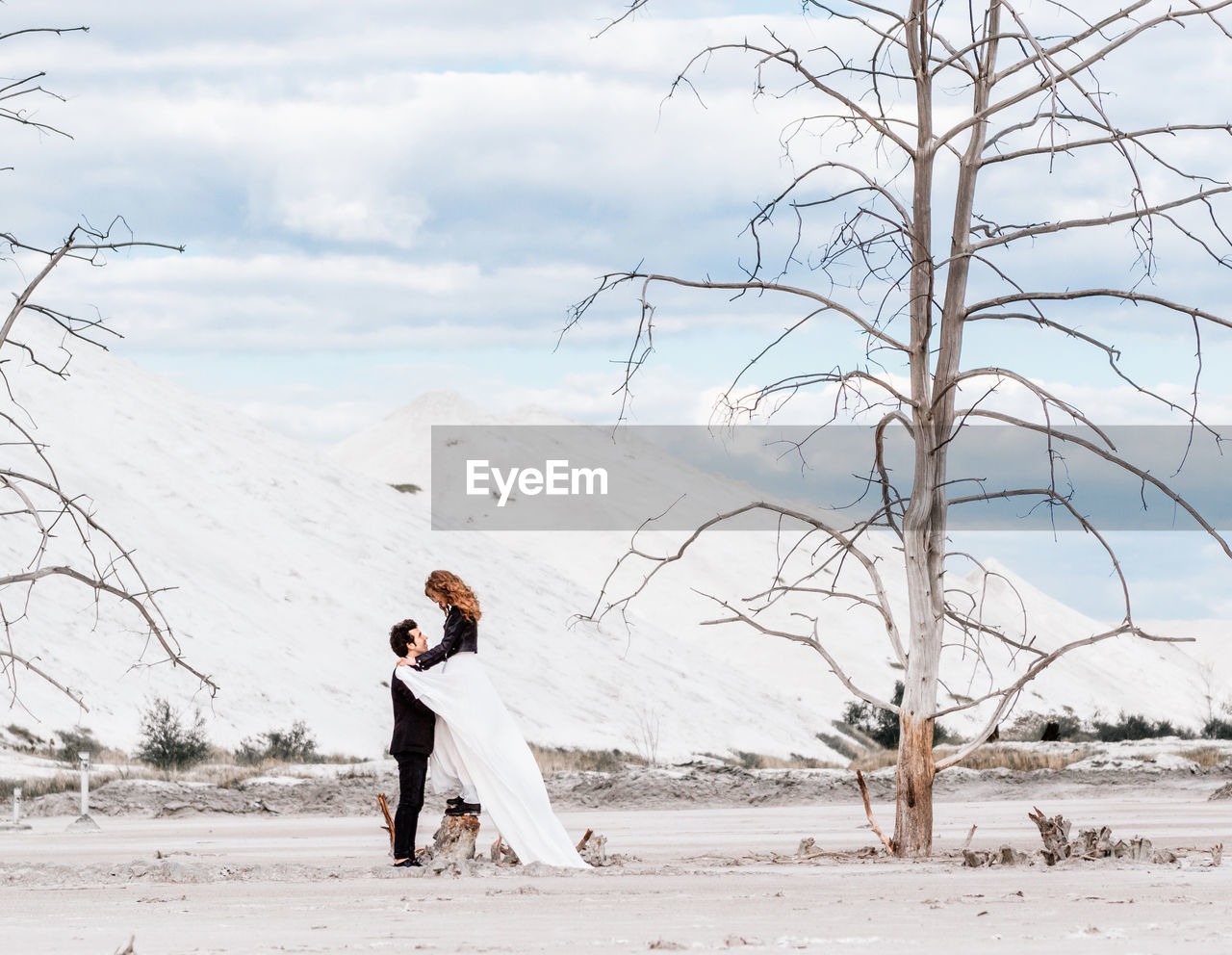 Full length of woman on snowy field against sky