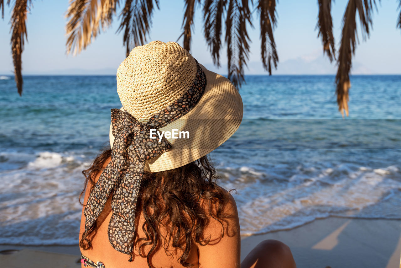 Woman relaxing at a beach.