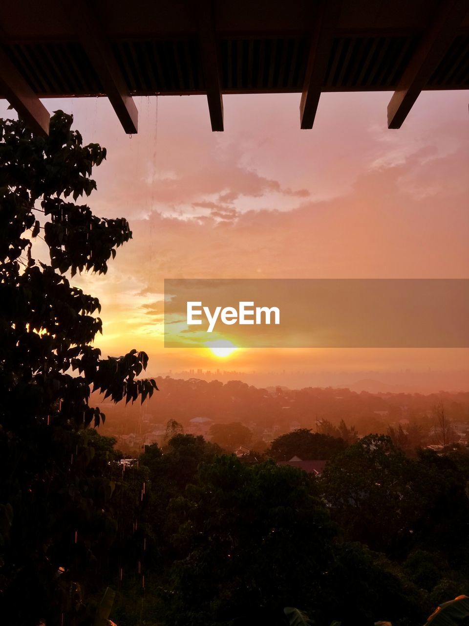 SCENIC VIEW OF SILHOUETTE LANDSCAPE AGAINST ORANGE SKY