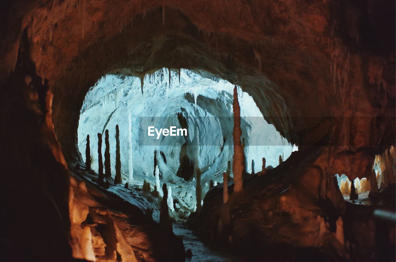 LOW ANGLE VIEW OF ROCK FORMATION IN CAVE