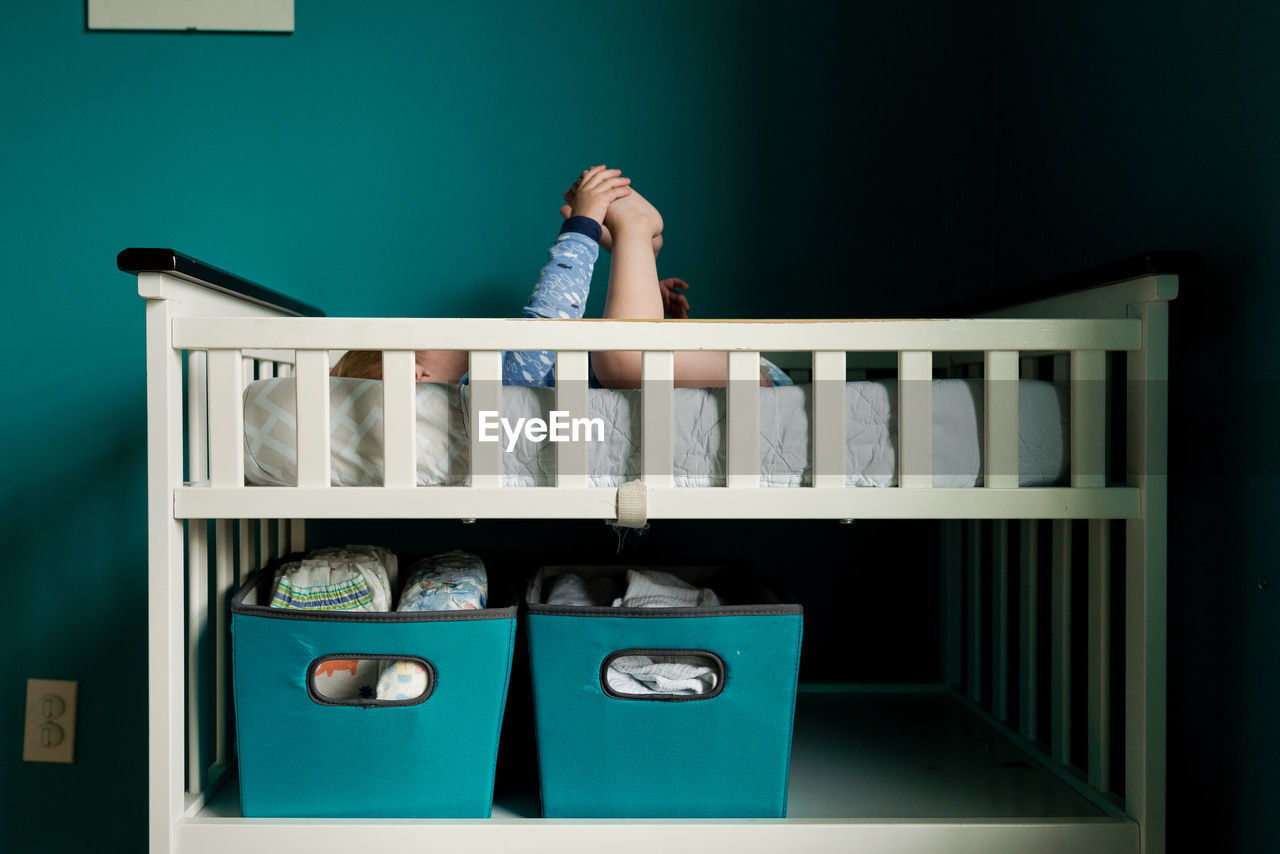 Side view of boy sleeping on bunkbed at home