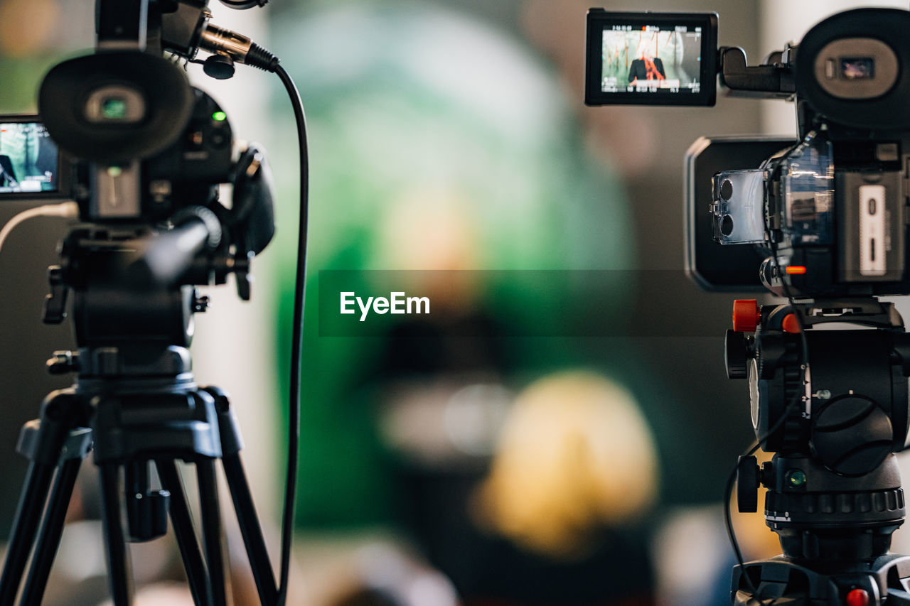 Cameras at a live media conference.