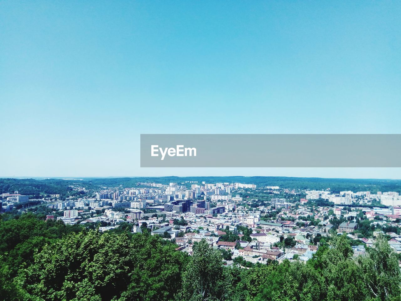 HIGH ANGLE SHOT OF TOWNSCAPE AGAINST CLEAR SKY