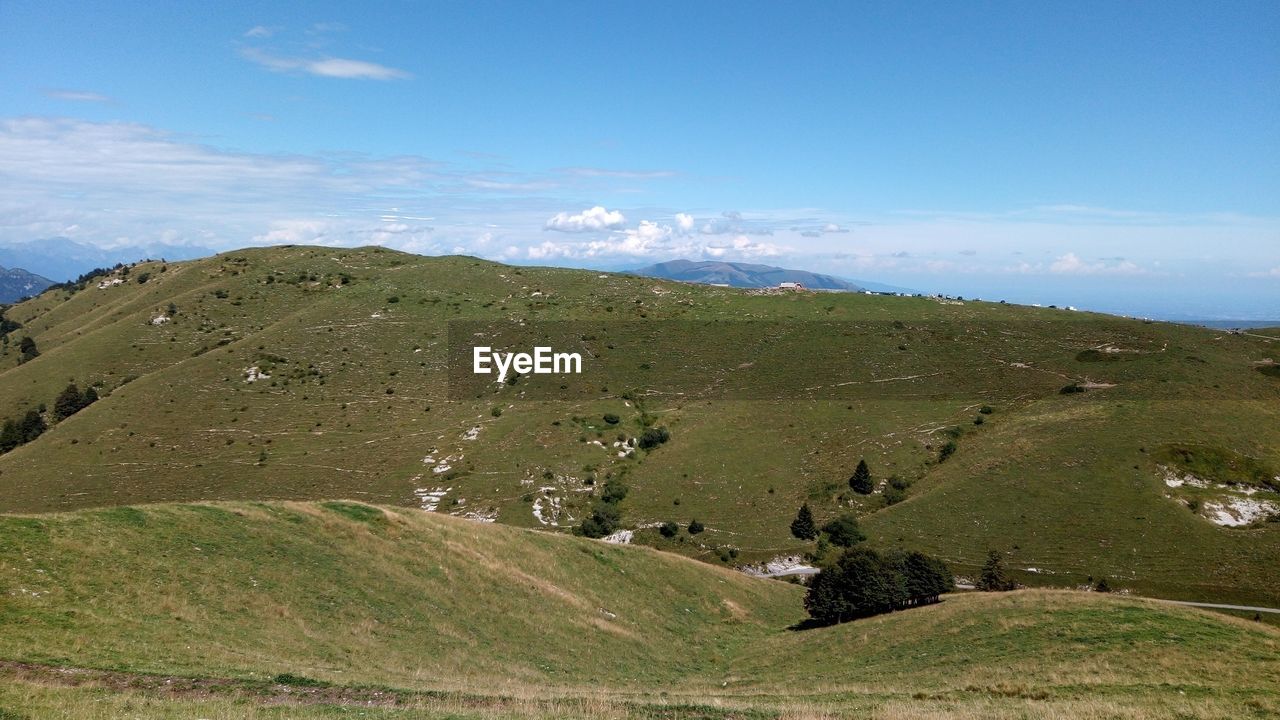 SCENIC VIEW OF LANDSCAPE AND MOUNTAINS AGAINST SKY