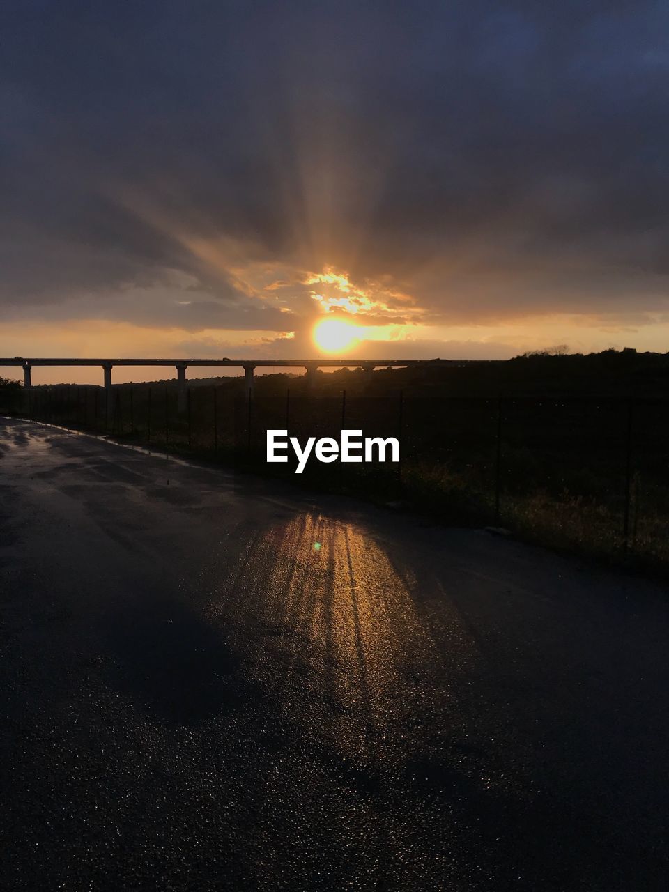 VIEW OF ROAD AGAINST SKY DURING SUNSET