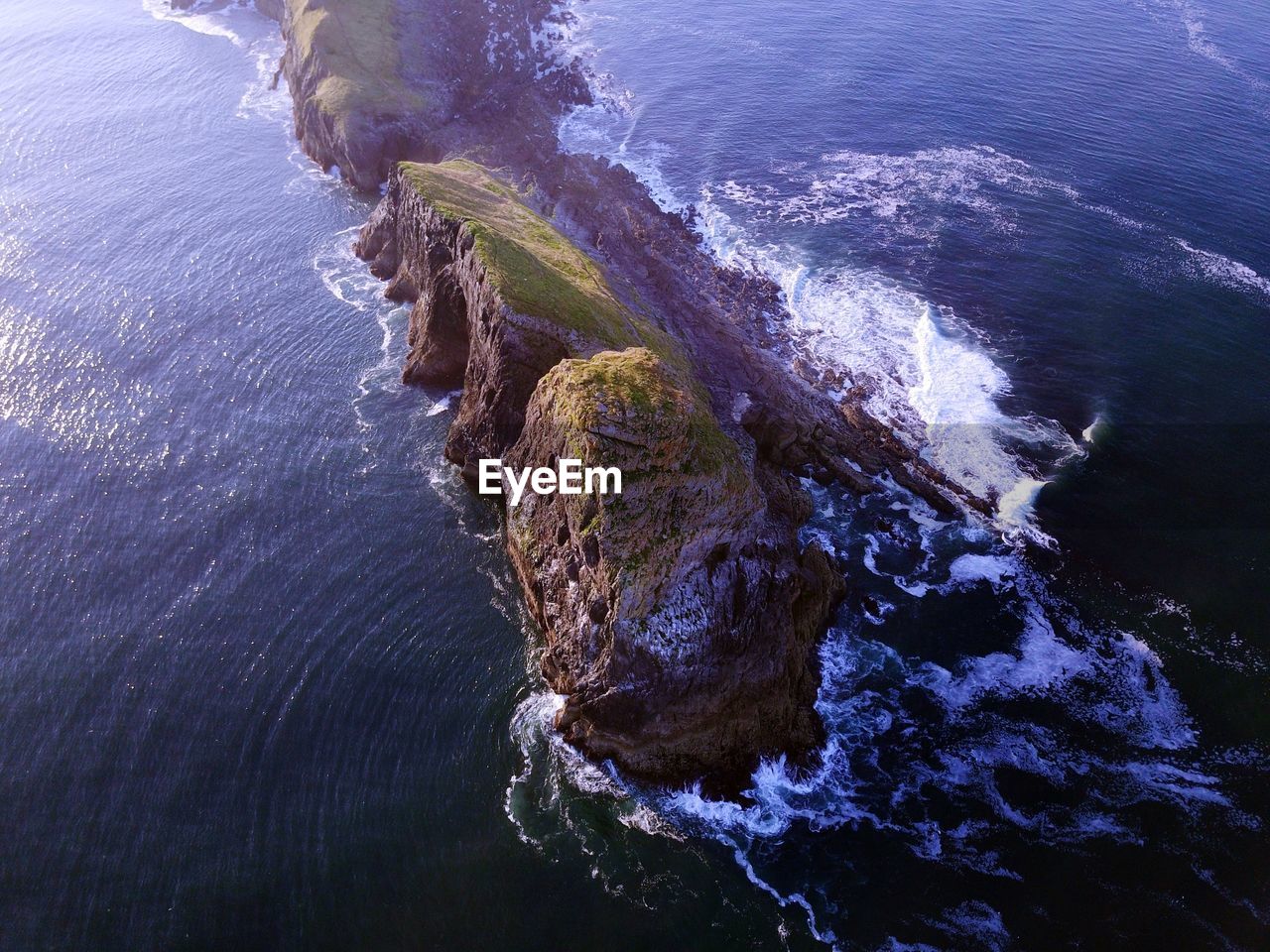 High angle view of rock formation in sea