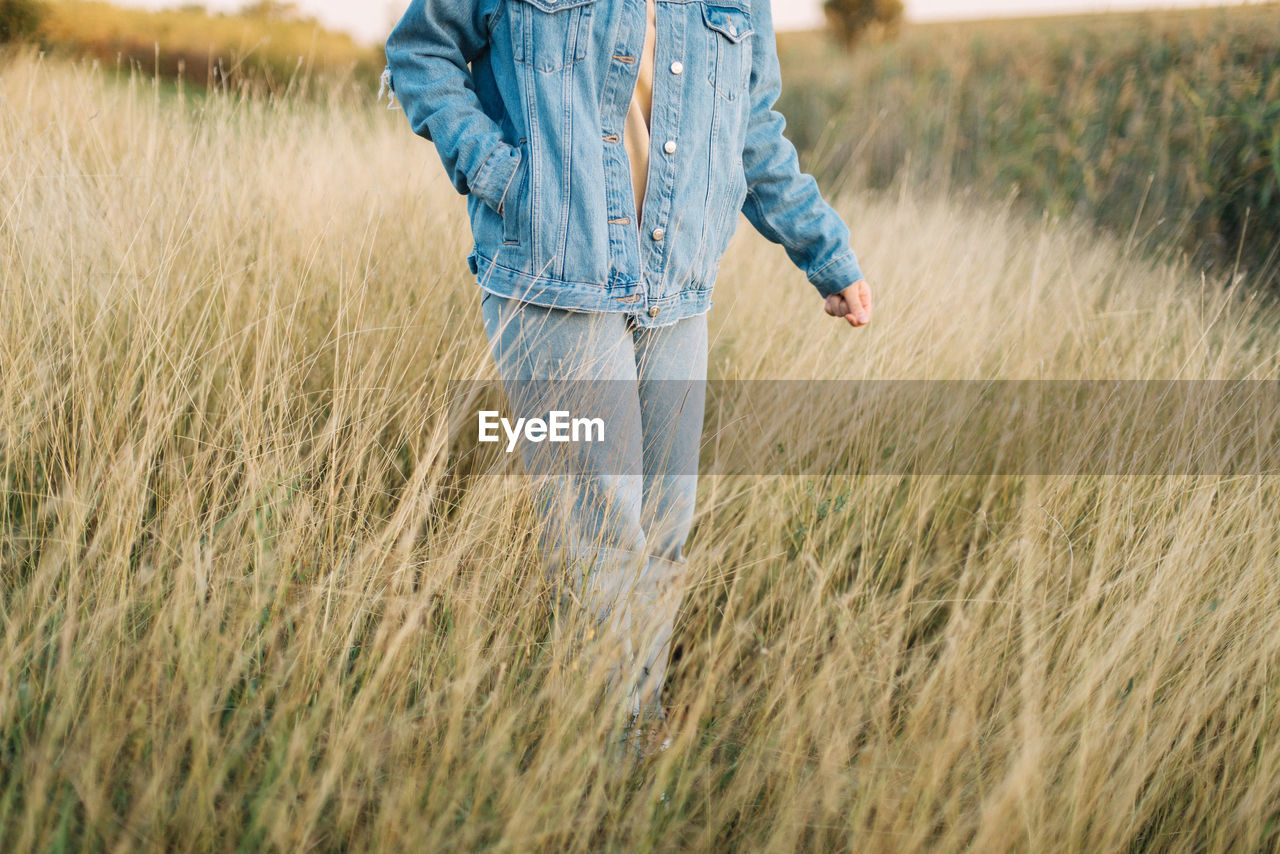 Full length of man walking in field