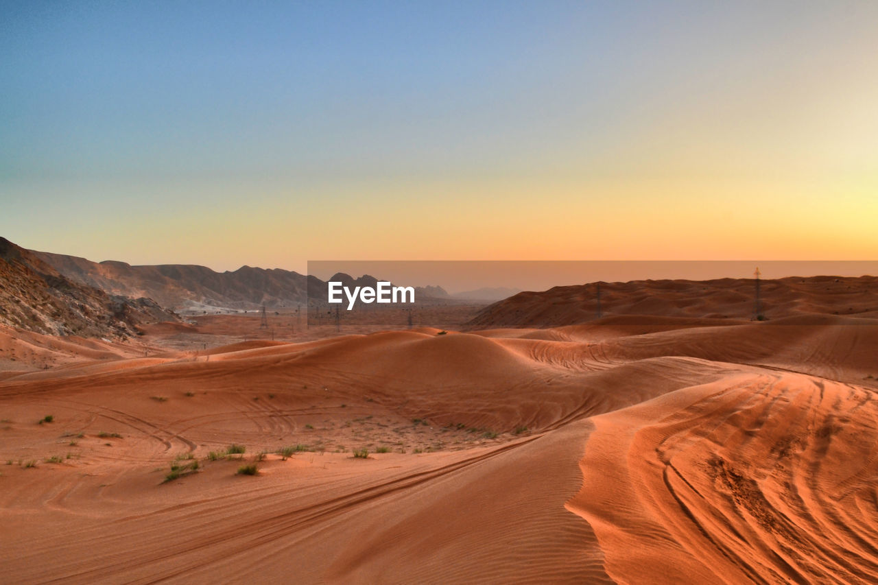 Scenic view of desert against clear sky