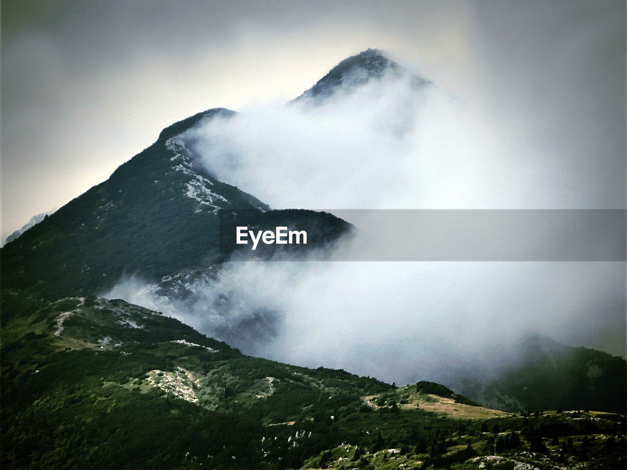 Scenic view of mountain in foggy weather
