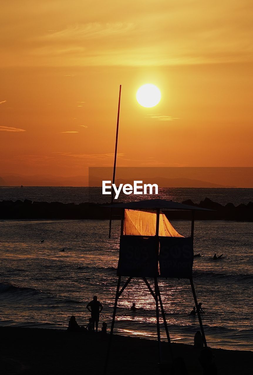 SCENIC VIEW OF SUNSET OVER SEA