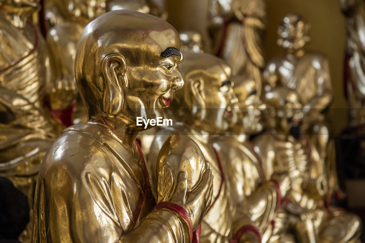 close-up of buddha statues