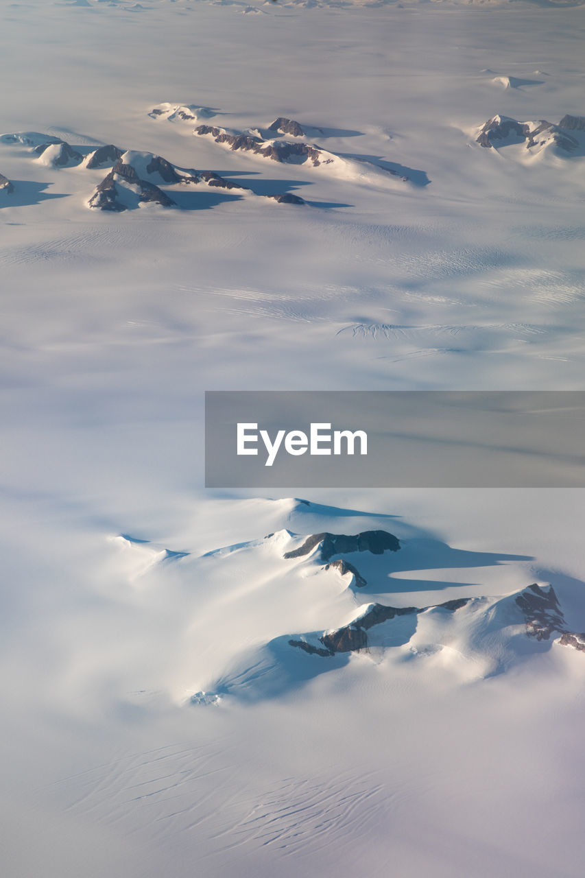 Scenic view of frozen lake against sky