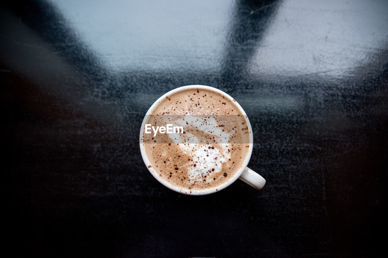 Directly above shot of coffee cup on table