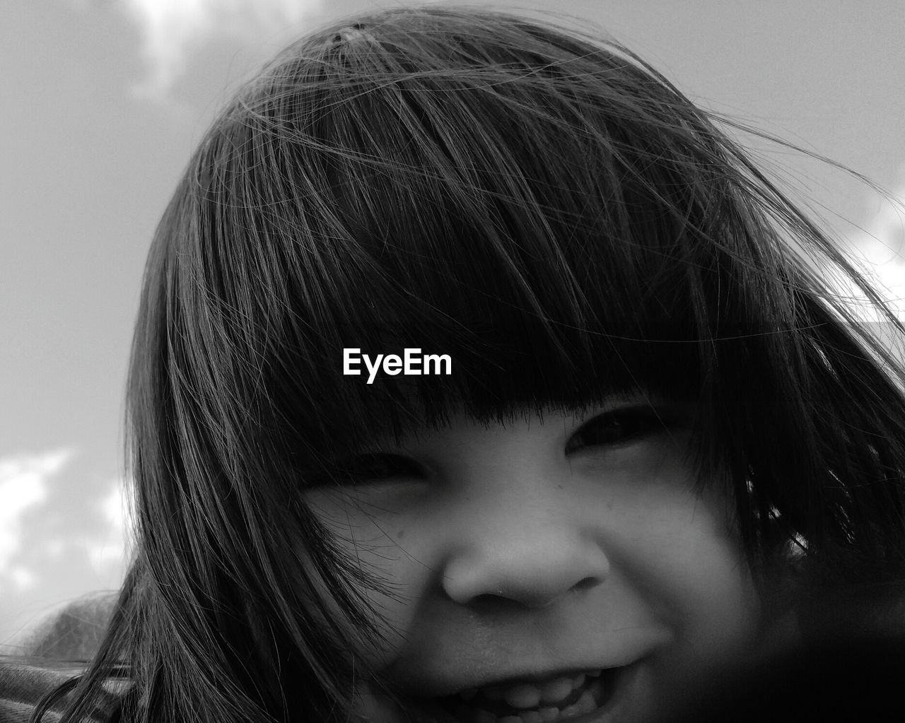 Close-up portrait of smiling cute girl