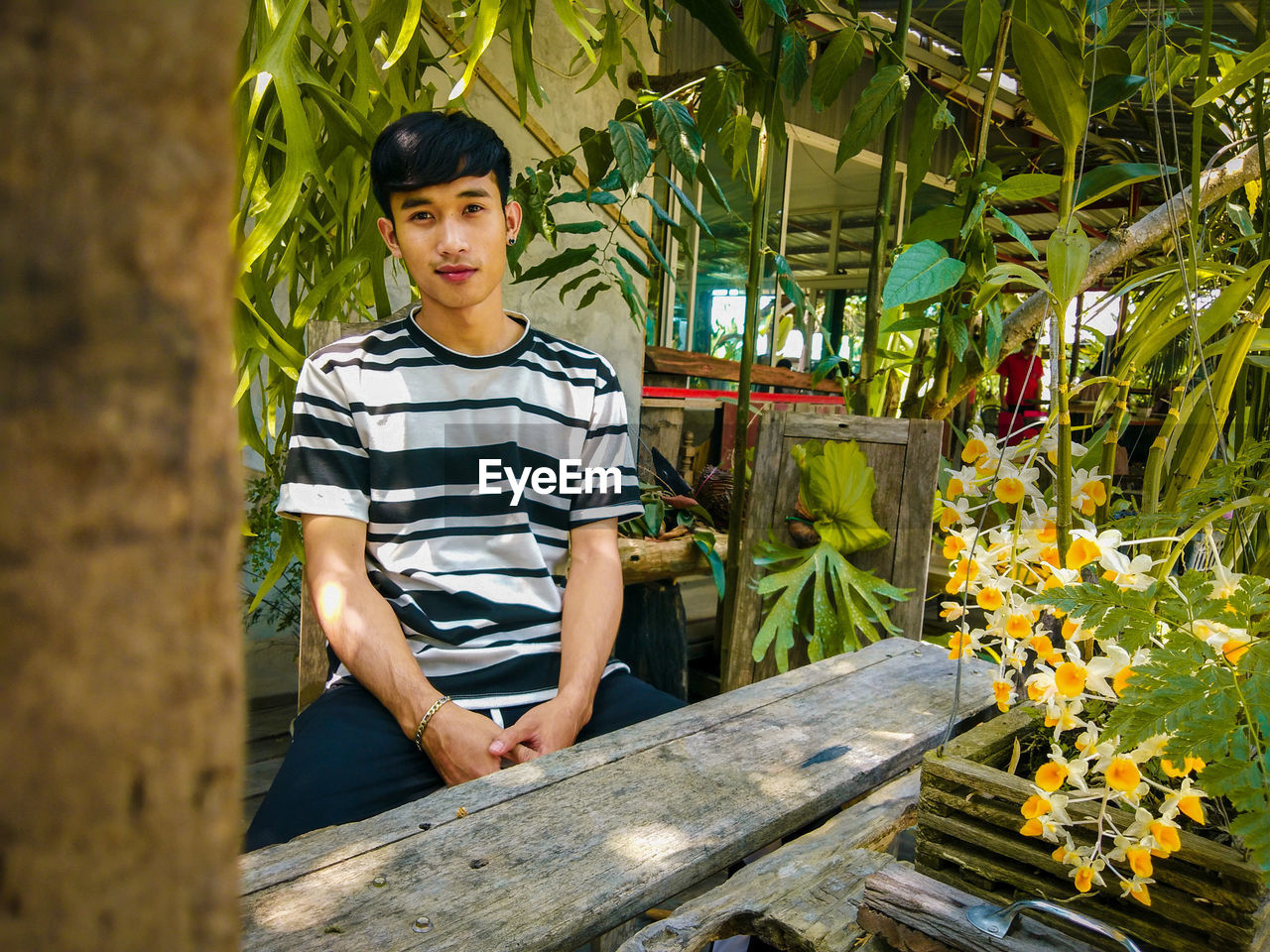 Portrait of young man sitting on chair