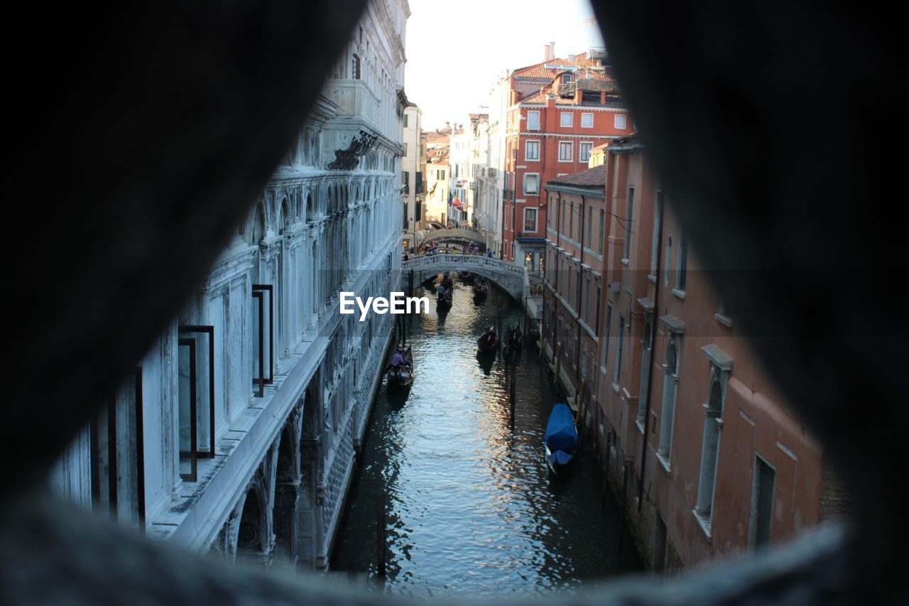 Canal amidst buildings in city