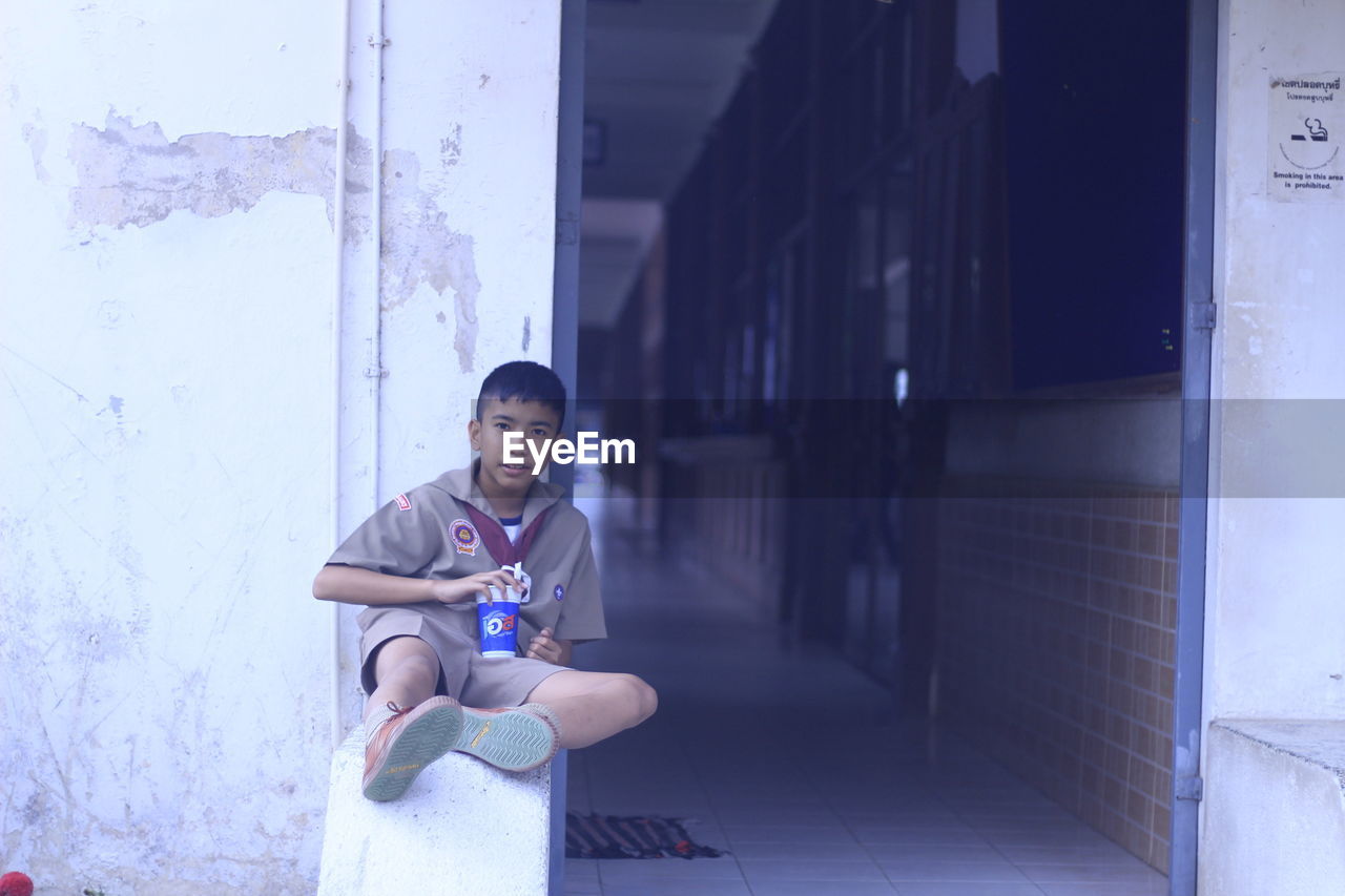 Portrait of school boy sitting in school