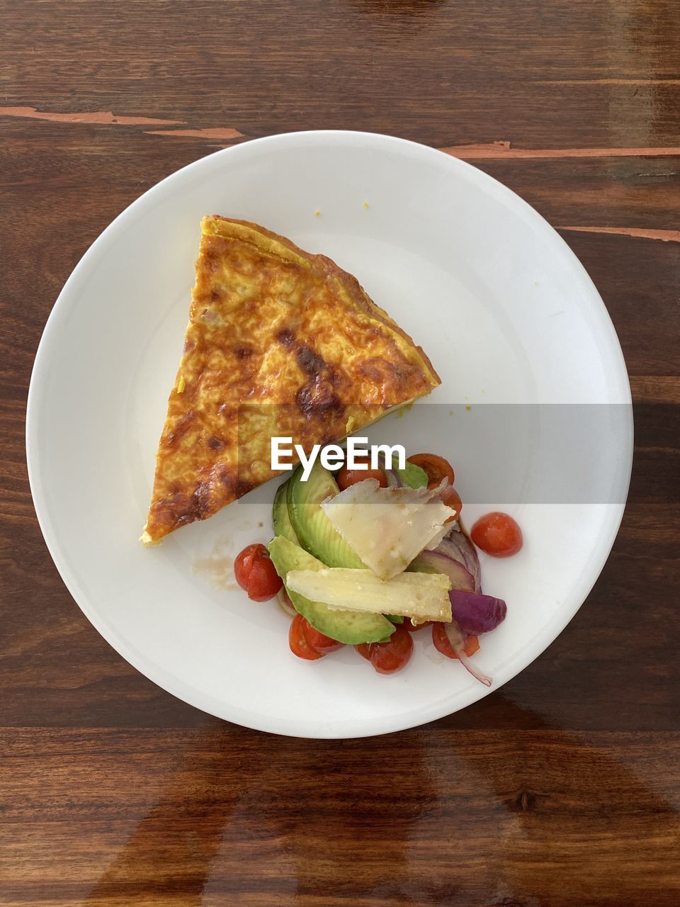 High angle view of breakfast served on table. quche lorraine