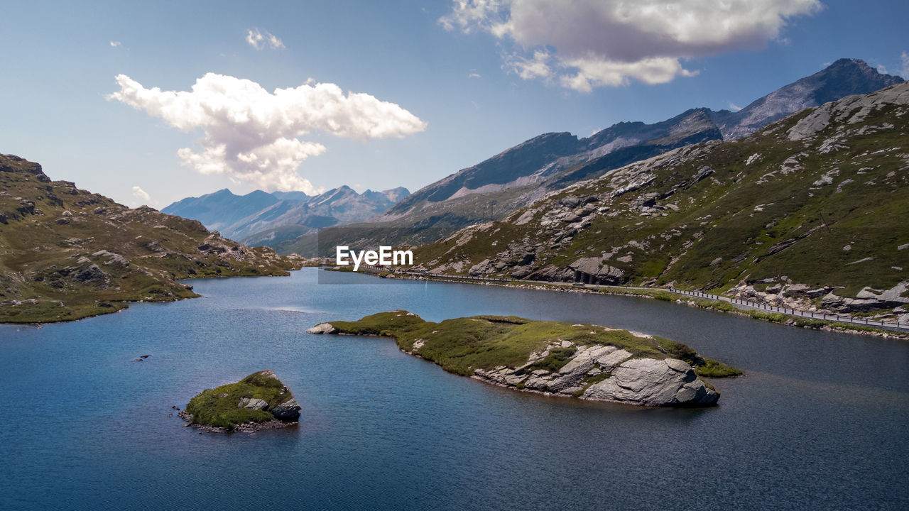water, mountain, scenics - nature, environment, sky, landscape, beauty in nature, nature, cloud, land, mountain range, travel destinations, lake, travel, reflection, no people, tranquility, body of water, tourism, blue, outdoors, tranquil scene, transportation, architecture, city, vacation, forest, trip, day, holiday, beach, plant, rock, nautical vessel, activity, idyllic, summer, panoramic, reservoir, mountain peak, pinaceae, tree