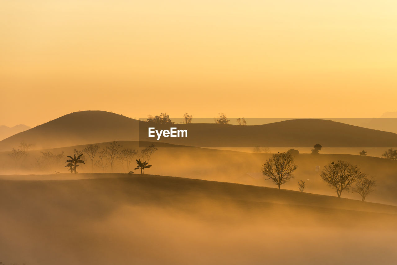 Scenic view of silhouette landscape against sky during sunset