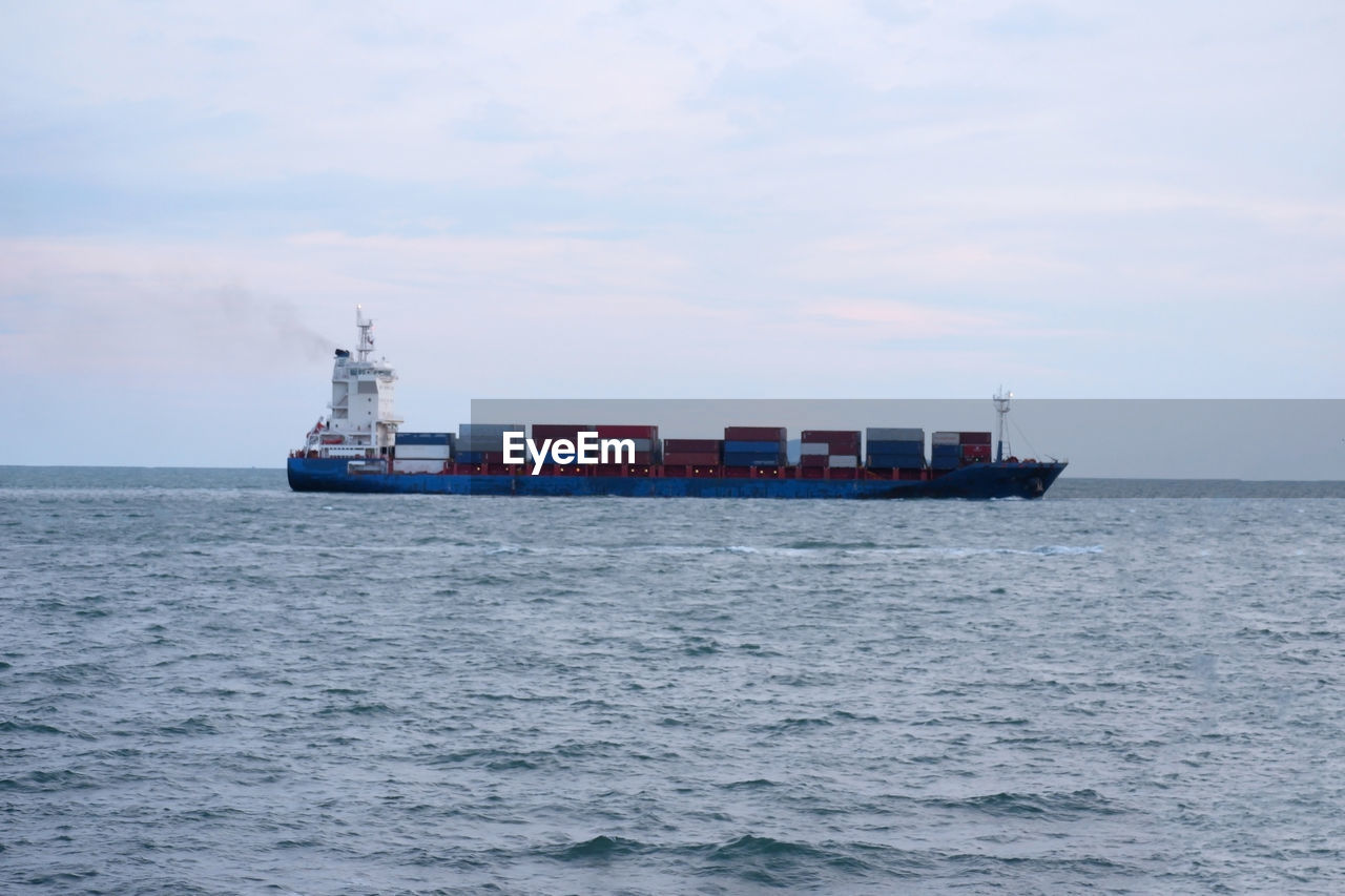 SHIP AT SEA AGAINST SKY