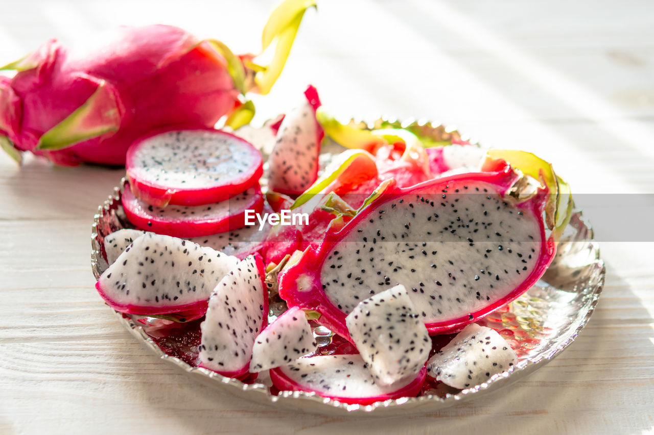 food and drink, food, healthy eating, fruit, freshness, birthday cake, strawberry, no people, dessert, produce, wellbeing, indoors, plant, sweet food, pitaya, plate, vegetable, close-up, dish, sweet, still life, cake