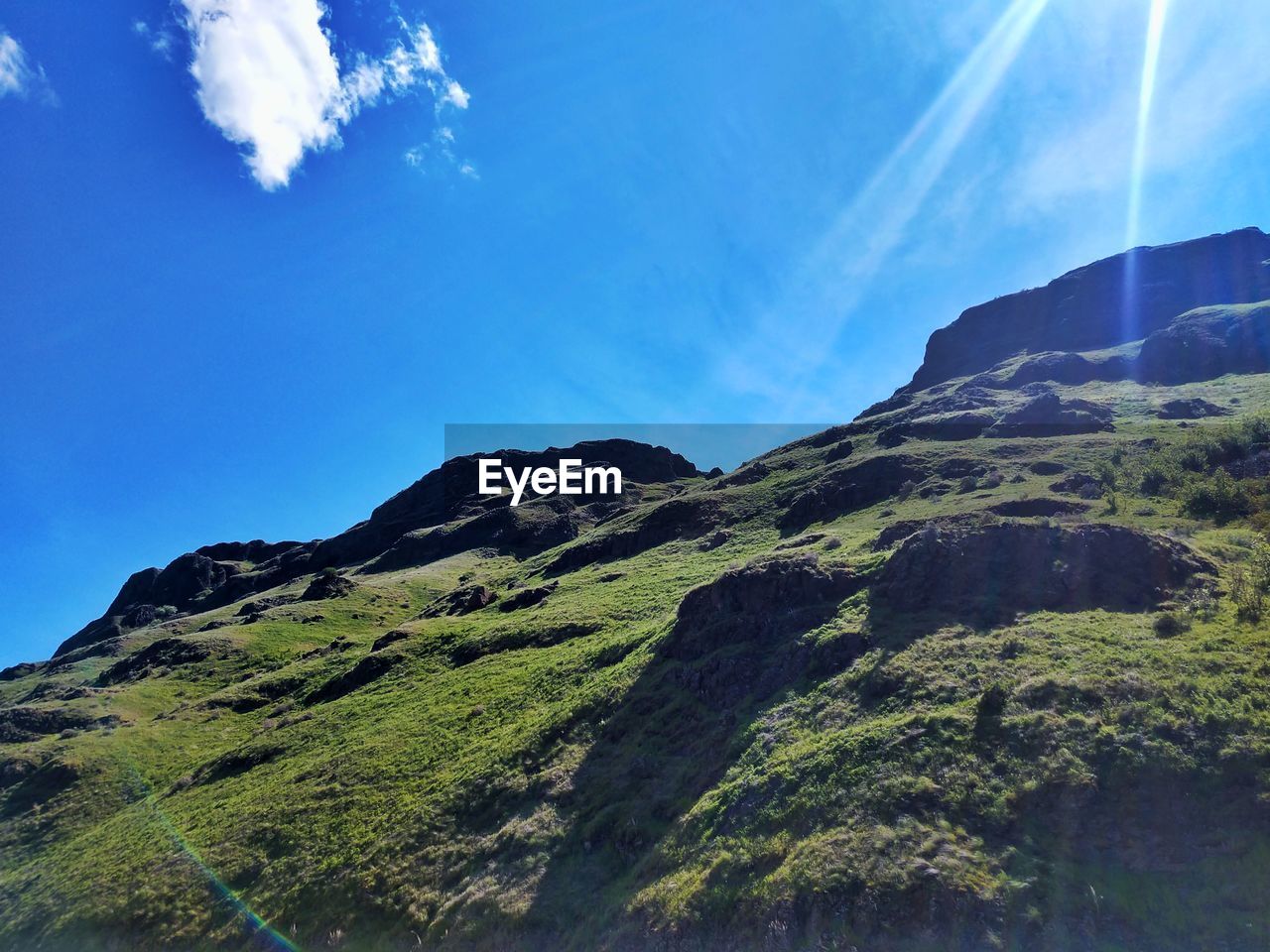 SCENIC VIEW OF MOUNTAINS AGAINST BLUE SKY