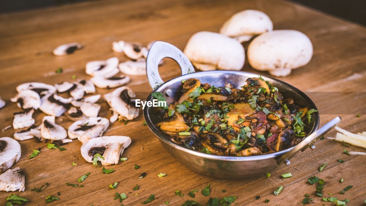 High angle view of mushrooms in bowl on table